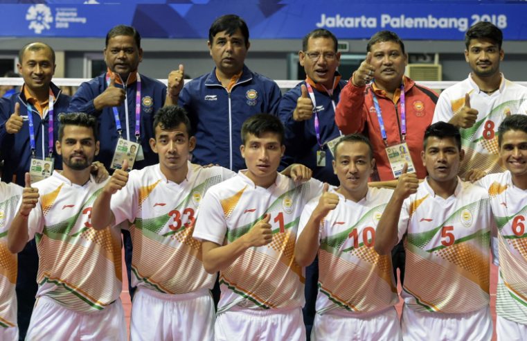 A Sepak-Takraw Team Showing Thumbs up After Their Victory.