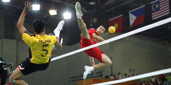 Two Sepak-takraw players in action during a tournament
